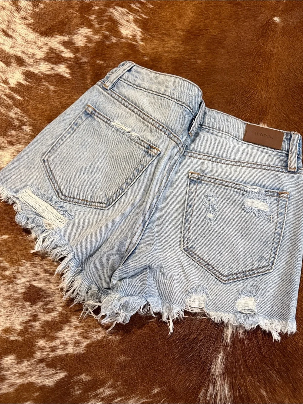 High-Rise Light Blue Distressed Denim Shorts